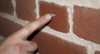 Placing wall plug in the screw hole