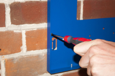 Screwing the mounting bracket to the wall