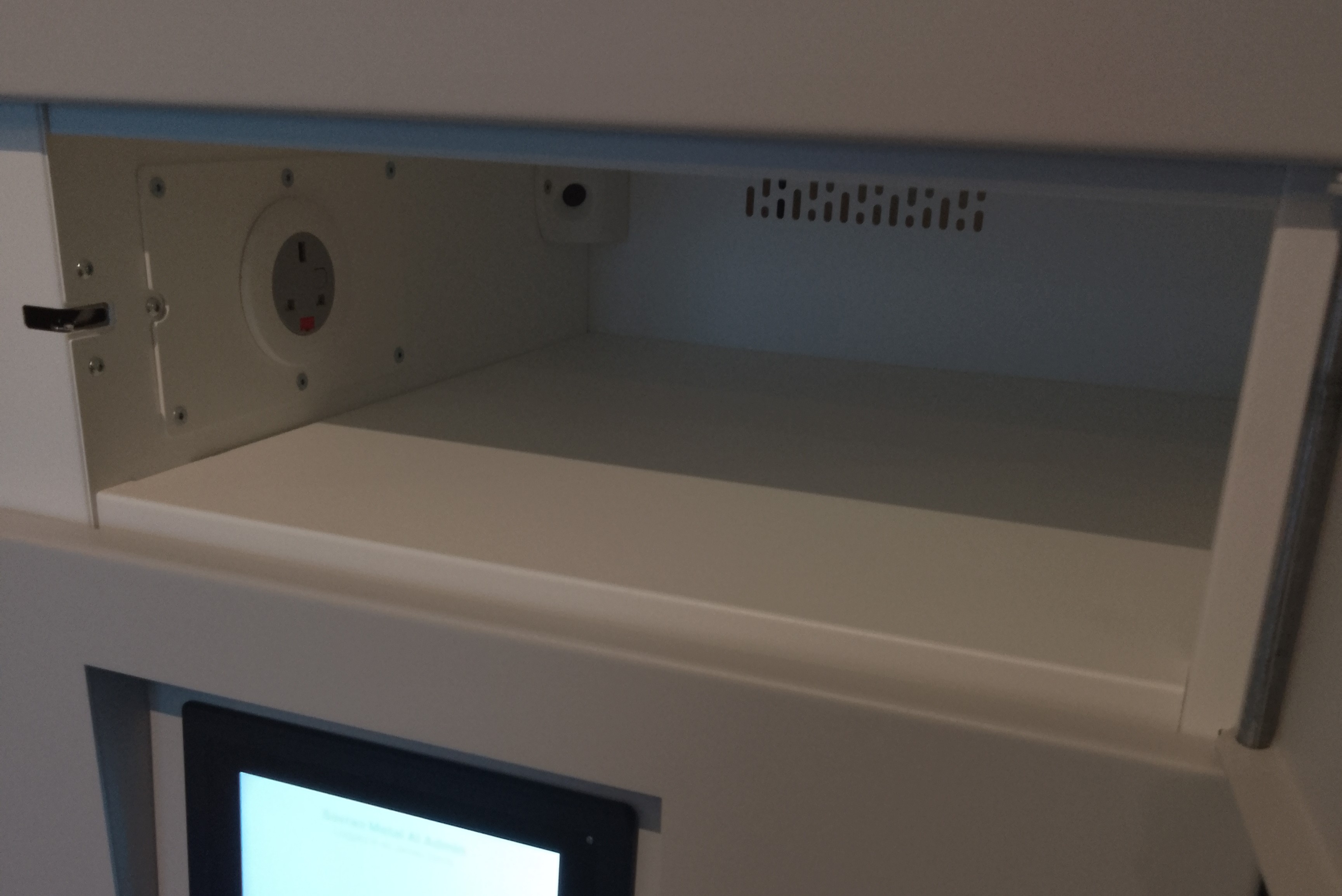 Inside view of a single height Sovran ChargeLine locker bay with AI asset detection camera
